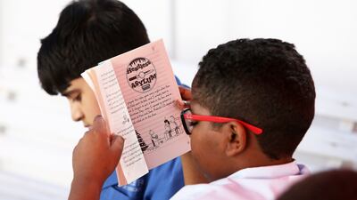 A student of grade 6 engrossed in a book, at Zakher Private School British Division in Al Ain, UAE, on March 3, 2016. Pawan Singh / The National
