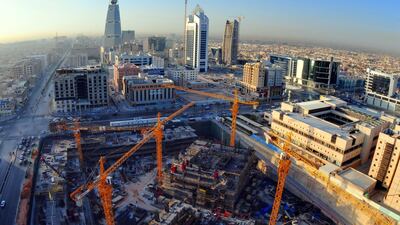 A construction site in Riyadh with the SBG-built Al Faisaliah Tower in the background. The company has built many of the kingdom's landmarks. Waseem Obaidi for The National