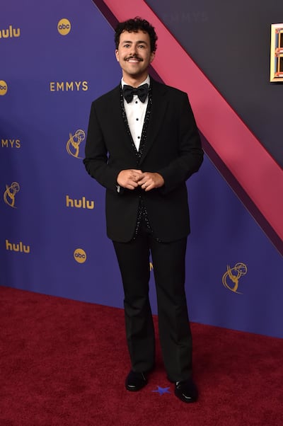 Ramy Youssef wears Giorgio Armani. AP