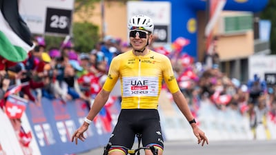 Tadej Pogacar crosses the finish line to win the fifth and last stage of the Tour de Romandie. EPA
