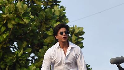 A camera person can be seen shadowing Khan on the balcony. AFP