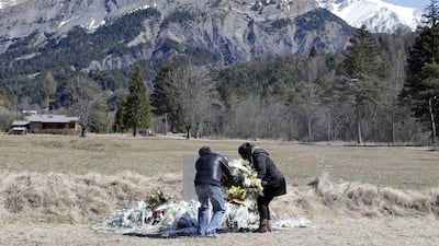 Relatives of crash victims pay their respects at the memorial for the victims of the air disaster in the village of Le Vernet, near the crash site in the French Alps. Eric Gaillard / Reuters