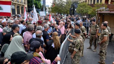 Retired officers and soldiers at a protest against the approval of the 2022 budget in Beirut. EPA