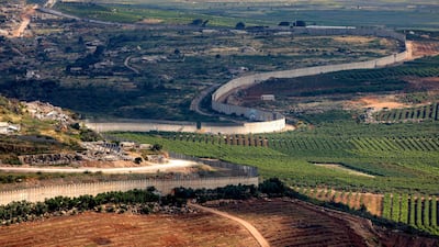 The border wall separating Israel (R) and Lebanon is pictured from a position along the Upper Galilee region of northern Israel. AFP