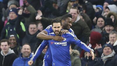 Chelsea’s Cesc Fabregas celebrates with John Obi Mikel after scoring to equalise 2-2 on Saturday against Everton in the Premier League. Justin Tallis / AFP