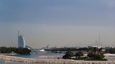 Smoke hangs over Dubai on Sunday morning. Reuters