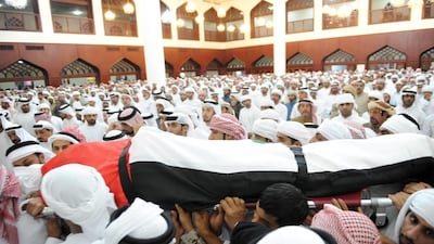 The body of Colonel Sultan Al Ketbi is carried during the funeral for the officer killed in Yemen. Hosam Elbaz / Al Ittihad