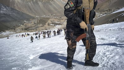 A member of the police force walks up the mountain during the race. Rick Findler for The National