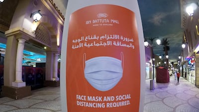 Visitors wearing the protective face mask to prevent the spread of the coronavirus at the Ibn Battuta Mall in Dubai. Authorities eased restrictions for residents in Dubai. Pawan Singh / The National
