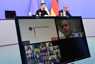 The Ukrainian President Volodymyr Zelenskyy, left, with Germany's Chancellor Friedrich Merz attend a video conference of European leaders with the US President on the Ukraine war. Getty Images