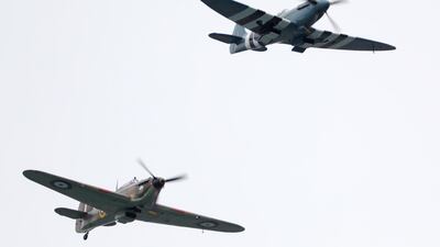 A flypast by WWII fighter aircraft, a Spitfire (top) and Hurricane (bottom), during the commemorations for the 75th Anniversary of the D-Day landings in Southsea Common, Portsmouth, Hampshire. EPA