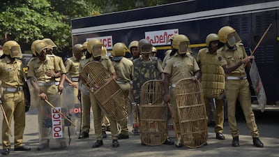 Policemen take position outside the state secretariat anticipating protests following two women entering the Sabarimala temple in Kerala, India. AP