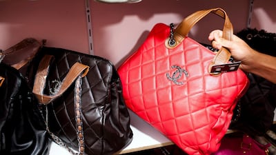 Counterfeit Louis Vuitton and Chanel handbags. Dubai Police have received almost 1,300 reports about intellectual property crimes since 2019. Andrew Henderson / The National