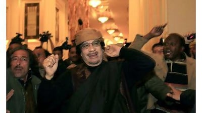 Libya's leader Muammar Gaddafi arrives to give television interviews at a hotel in Tripoli.