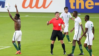 Saudi Arabia's Fhad Al Muwallad, left, celebrates with his teammates scores his side's opening goal during winning the 2018 World Cup group B qualifying soccer match between Saudi Arabia and Japan in Jiddah, Saudi Arabia, Tuesday, Sept. 5, 2017. Saudi Arabia won 1-0. (AP Photo)
