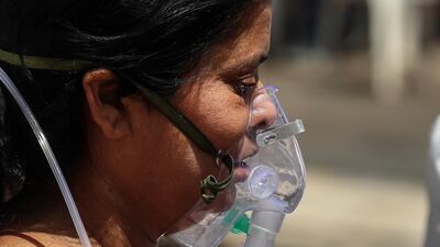 A suspected Covid-19 positive patient receives oxygen treatment at the Covid-19 hospital Ahmedabad, India. EPA