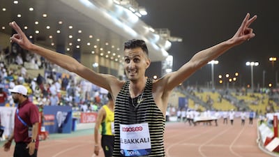 Soufiane El Bakkali celebrates winning the men's steeplechase event at the 2022 Diamond League meeting in Doha. AFP