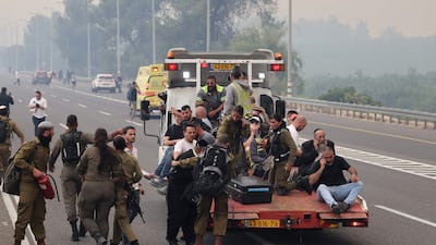 People are evacuated from a motorway near the central Israeli town of Bet Shemesh. AFP