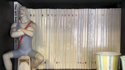 A large, wooden, custom-made cabinet boasts an extensive DVD, book and magazine collection. Pawan Singh / The National