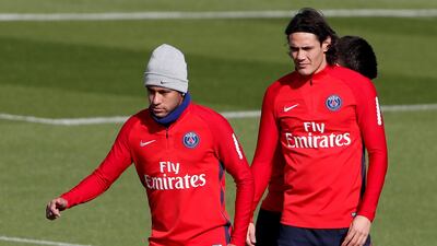Neymar, left, and Edinson Cavani in training ahead of PSG's Ligue 1 match against Montpellier. Benoit Tessier / Reuters