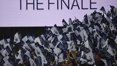 Tottenham fans wave flags as a message is displayed on the big screen during their match with Manchester United in London on May 14, 2017. Dylan Martinez / Reuters