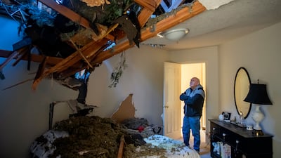 Bill Drummond after high winds caused a tree to crash through two of his upstairs bedrooms in Hazel Dell, Washington. AP