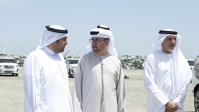Dr Ahmed Al Mazrouei, chairman of the Abu Dhabi Executive Office, with Sheikh Rashid bin Hamad at the port