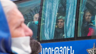 Ethnic Armenians look out from a bus returning to Stepanakert, the capital of the separatist region of Nagorno-Karabakh in Yerevan, Armenia. Armenia and Azerbaijan have agreed to halt fighting in the Nagorno-Karabakh region of Azerbaijan under an agreement signed with Russia that calls for deployment of nearly 2,000 Russian peacekeepers and territorial concessions. AP Photo