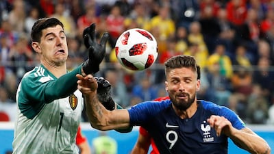 Belgium's Thibaut Courtois in action with France's Olivier Giroud. EPA