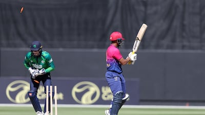 UAE's Aryansh Sharma is stumped by Ireland's Lorcan Tucker during the second T20 at the Dubai International Stadium. All images Chris Whiteoak / The National