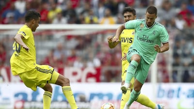Hazard and Diego Reyes of Fenerbahce fight for the ball. Getty