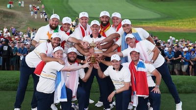 Team Europe celebrate with the Ryder Cup trophy. AFP