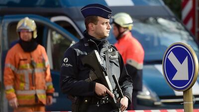 Policemen and firemen set a security cordon around Brussels' Great Mosque in Brussels on November 26. AFP Photo