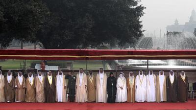 The delegation accompanying Sheikh Mohammed bin Zayed, Crown Prince of Abu Dhabi and Deputy Supreme Commander of the Armed Forces, stands for the national anthems of the UAE and India during a ceremonial reception at the Presidential Palace in New Delhi, India, on Wednesday. Manish Swarup / AP Photo