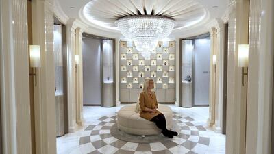 An employee poses in the Salon de Parfums in Harrods. Luke MacGregor / Reuters