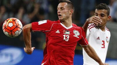 UAE’s Walid Abbas (R) fights for the ball with Palestine’s Jaka Hbaisha (L) during their World Cup 2018 Asian qualifying football match on March 24, 2016 at Mohammed Bin Zayed Stadium in Abu Dhabi. AFP / KARIM SAHIB