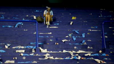 An Argentina fan chats on her mobile phone after her home team played Peru to a 0-0 draw, after a World Cup qualifying soccer match at La Bombonera stadium in Buenos Aires, Argentina, Thursday, Oct. 5, 2017. The draw has left Argentina with little possibility to make it to the World Cup in Russia. (AP Photo/Natacha Pisarenko)