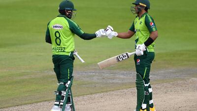 Pakistan's Mohammed Hafeez, left celebrates his half century. PA