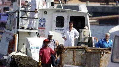 The crew of sea vessel MT Irene and hostages who were released by Somalian pirates last week arrive in a tug boat at Port Fujairah on Oct 14.