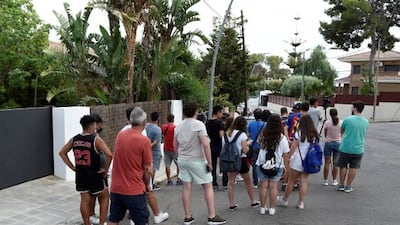 Fans gather outside the home of Barcelona's Argentinian forward Lionel Messi hoping to catch a glimpse of their hero.