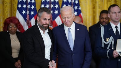 Former Metropolitan Police Department officer Michael Fanone is given his medal. AFP