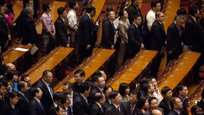 Delegates leave following a vote to repeal presidential term limits at a session at the first session of the 13th National People's Congress (NPC) at the Great Hall of the People in Beijing. Giulia Marchi / Bloomberg