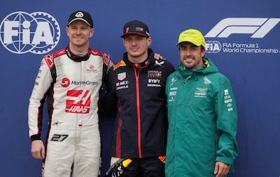Red Bull's Max Verstappen poses after qualifying in pole position alongside second positioned Haas' Nico Hulkenberg and third positioned Aston Martin's Fernando Alonso. Reuters