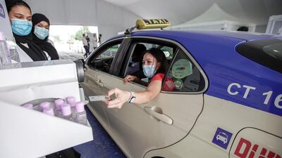 The National Screening Center, Mina Rashed, Dubai. A passenger in a Dubai Taxi about to get tested at the center. Victor Besa / The National