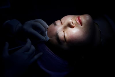 A woman gets a Botox injection in Seoul. Only about 3.6 per cent of the Chinese population had tried medical cosmetology by 2019, compared with 21 per cent in South Korea and 17 per cent in the US, accoding to Deloitte. Reuters