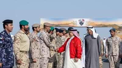 Sheikh Mohamed with King Hamad greeting members of the UAE Armed Forces.