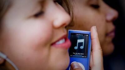 Younger consumers prefer free or low-cost music services such as Spotify because they are reluctant to pay for songs. Michal Czerwonka / Getty Images / AFP