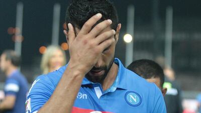 Napoli defender Miguel Britos reacts at the end of his side's Serie A loss to Udinese on Sunday. Lancia / EPA / September 21, 2014