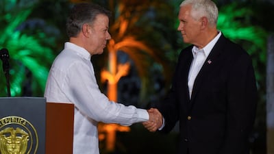 Colombia's president Juan Manuel Santos greets US vice president Mike Pence after a press conference in Cartagena, Colombia on August 13, 2017. Colombian Presidency/Handout via Reuters