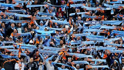 New York City FC fans get behind their team at Yankee Stadium. Elsa / Getty Images / AFP